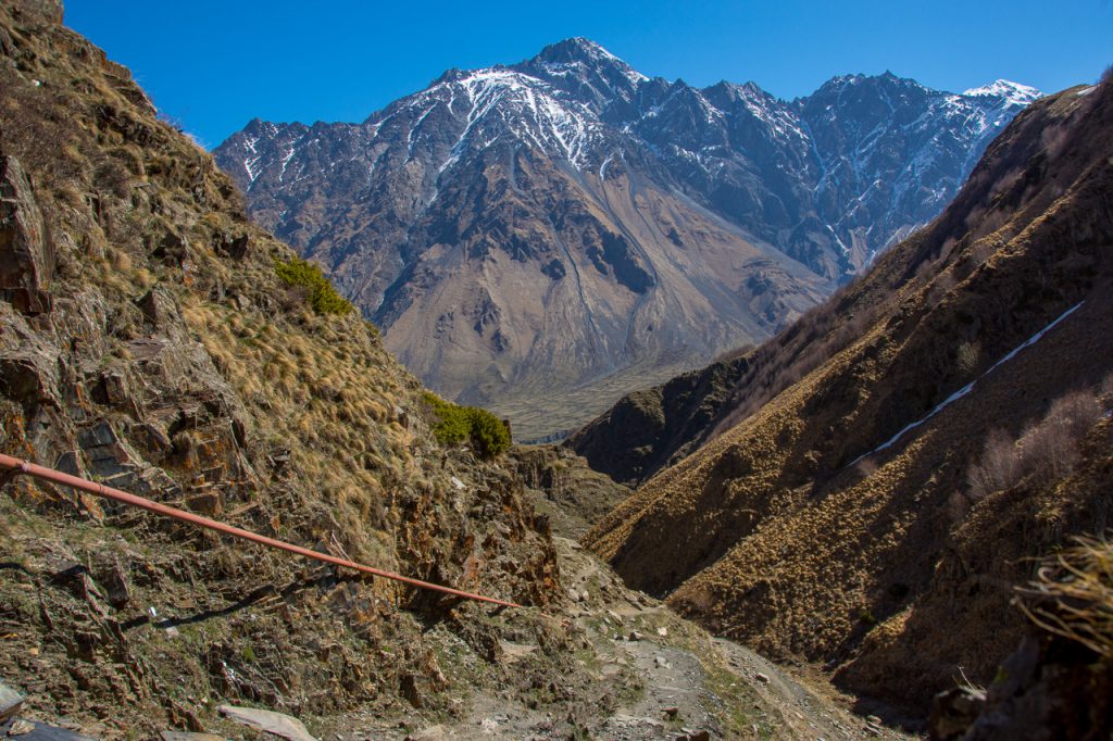 ruined tower Gergeti Trinity Church hiking path