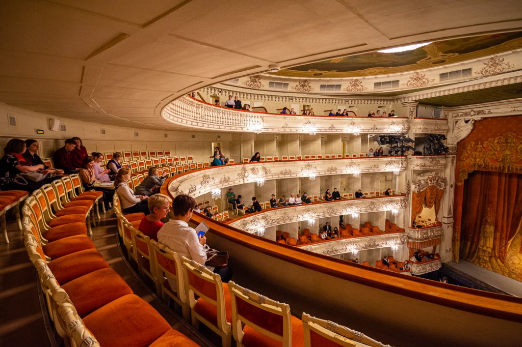 Sitting high up in the third circle of the Mikhailovsky theatre on red velvet chairs
