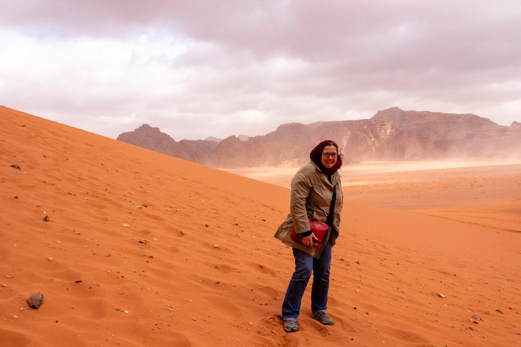 Anja insufficiently wrapped up against the desert winds