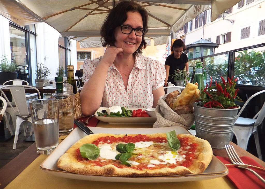 Eating pizza in Obika in Rome