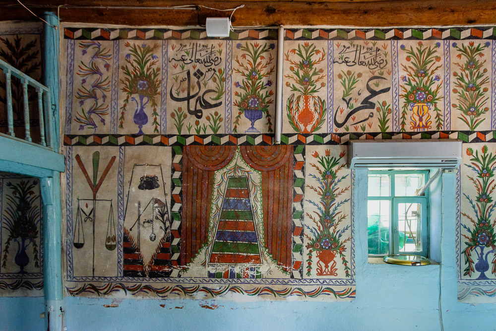 IN this small brick and timber mosque, the walls are frescoed with flowers and scenes of Judgement Day