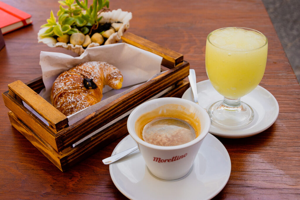 a Sicilian breakfast of coffee, granita and a chocolate-filled cornetto