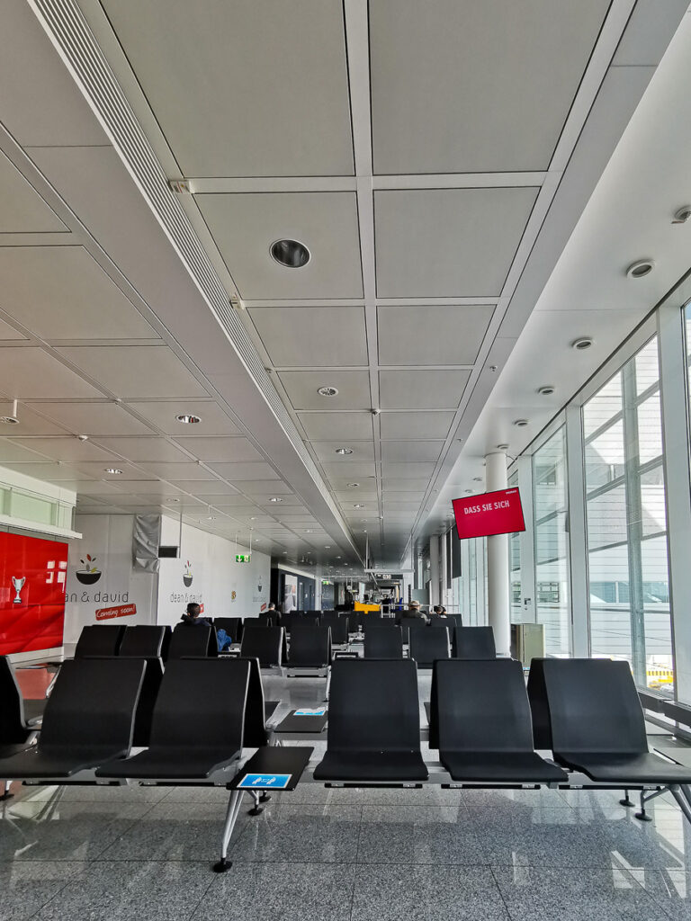 Empty departure lounge in Munich Airport while flying in Europe during COVID-19