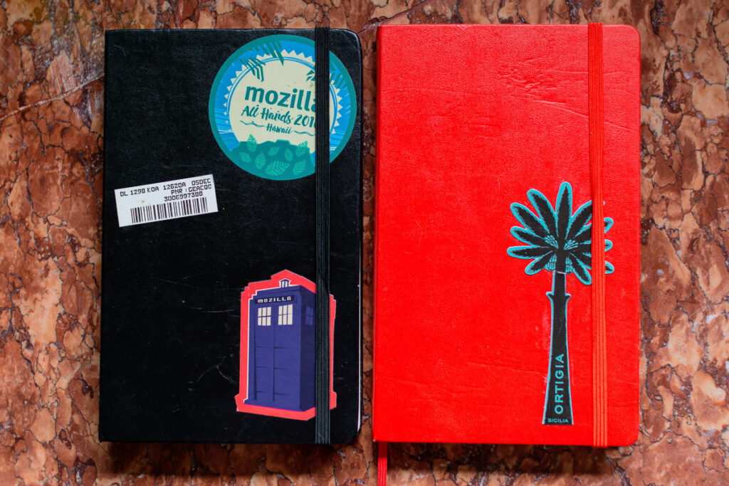 Two well used Moleskine notebooks