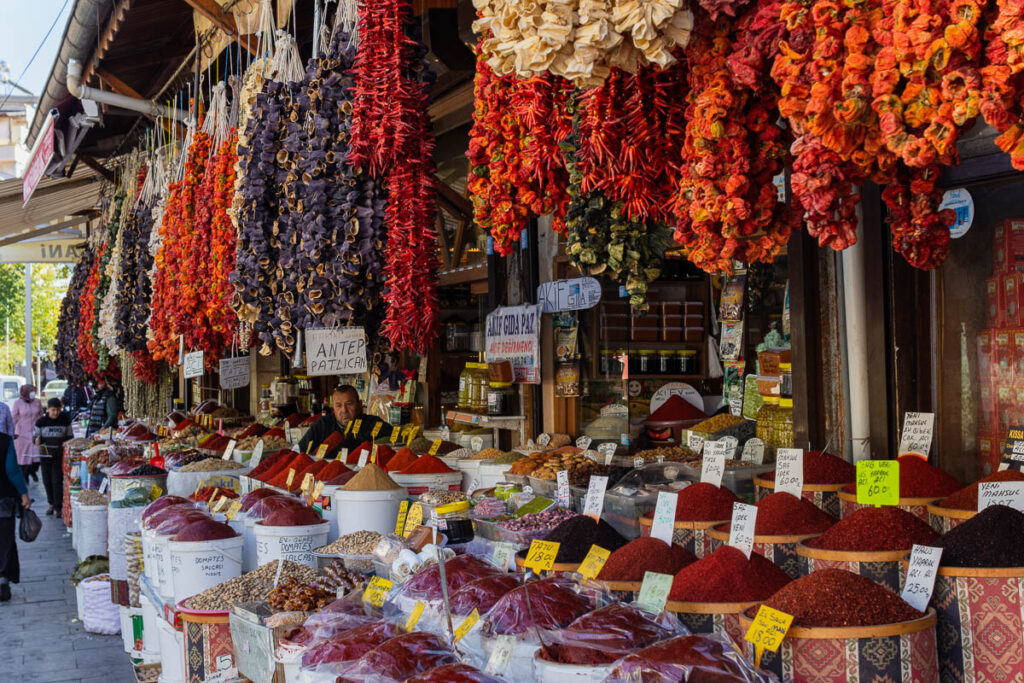 An array of dried peppers, aubergines, as well as buckets full if chili and other spices a t a market stall in Gaziantep