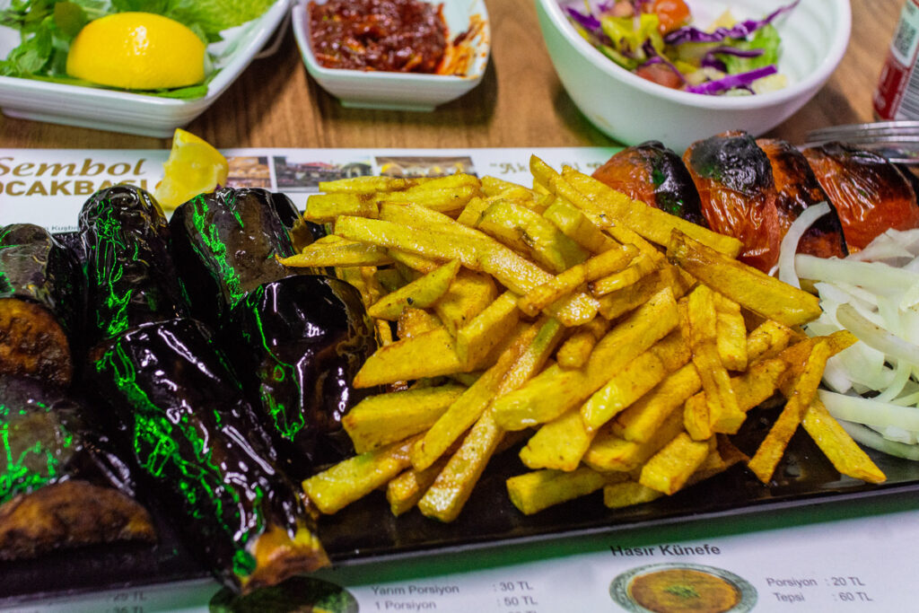 a vegetarian huge plate of Turkish grilled aubergine and pepper, with french fries