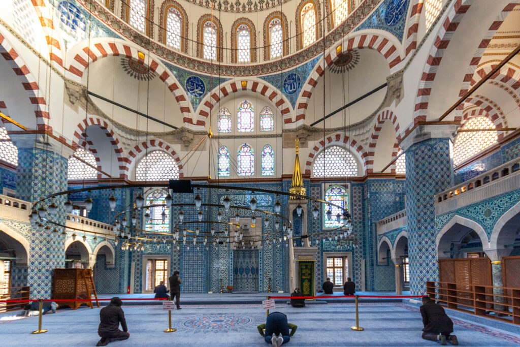 Rustem Pasa Mosque in the Bazaar area, Istanbul with its glorious Iznik tiles just after prayer time, with only a few worshippers